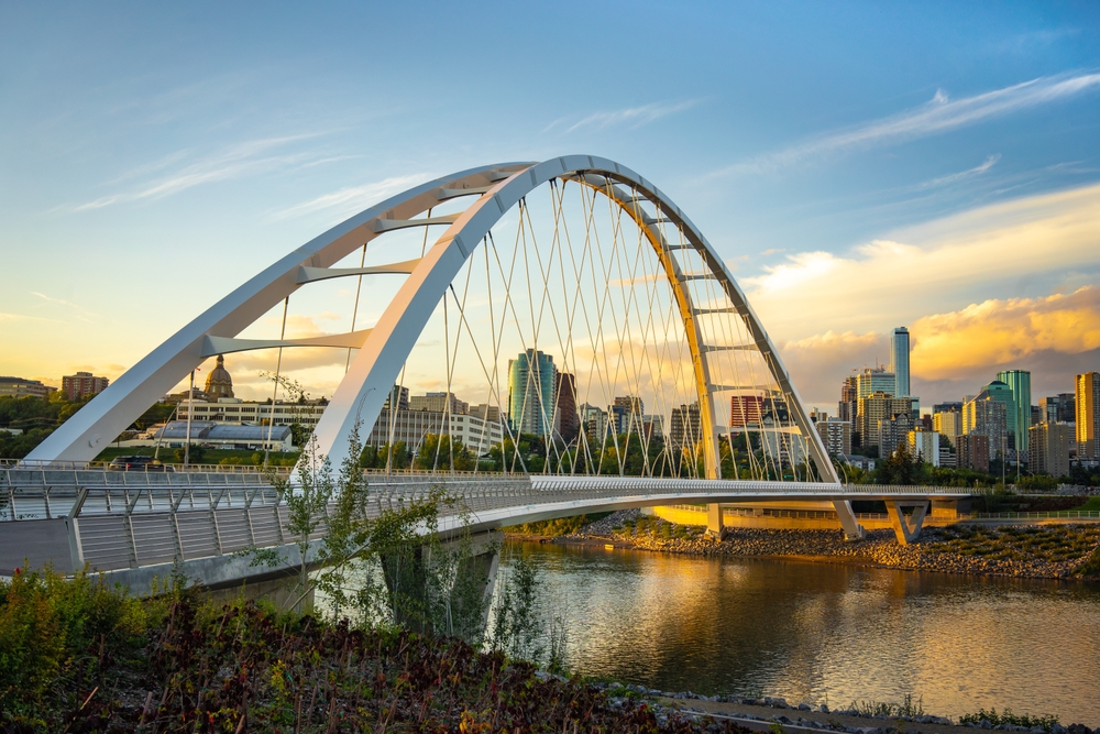 Walterdale suspension bridge and saskatchewan river with skyline in Edmonton Alberta Canada at dusk